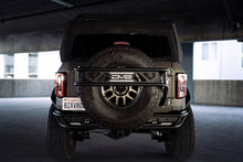 Load image into Gallery viewer, DV8 Offroad 21-23 Ford Bronco Spare Tire Guard & Accessory Mount