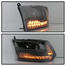 Load image into Gallery viewer, xTune Dodge Ram 13-17 ( w/ Factory Projector LED) Projector Headlight - Black HD-JH-DR13-P-BK
