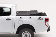 Load image into Gallery viewer, Extang 05-16 Nissan Frontier(5ft Bed) (w/ or w/o Track Sys) (5ft) Solid Fold 2.0
