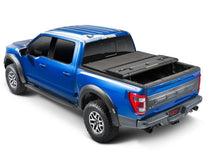 Load image into Gallery viewer, Extang 05-21 Nissan Frontier w/Factory Side Bed Rail Caps (5ft. Bed) Solid Fold ALX
