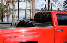 Load image into Gallery viewer, Lund 07-13 Toyota Tundra Fleetside (5.5ft. Bed) Hard Fold Tonneau Cover - Black
