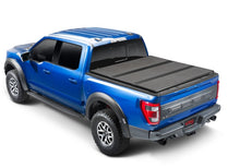 Load image into Gallery viewer, Extang 05-21 Nissan Frontier w/Factory Side Bed Rail Caps (5ft. Bed) Solid Fold ALX
