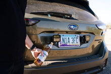 Load image into Gallery viewer, DV8 Offroad Universal License Plate Mount w/ Pod Light Mounts
