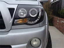 Load image into Gallery viewer, Spyder Toyota Tacoma 05-11 Projector Headlights LED Halo LED Black High H1 Low H1 PRO-YD-TT05-HL-BK
