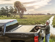 Load image into Gallery viewer, Roll-N-Lock 2020 Chevy Silverado / GMC Sierra 2500-3500 80-1/2in M-Series Retractable Tonneau Cover
