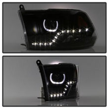 Load image into Gallery viewer, xTune Dodge Ram 2009-2014 Halo LED Projector Headlights - Black PRO-JH-DR09-CFB-BK
