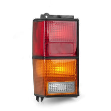 Load image into Gallery viewer, Omix Left Tail Lamp 84-96 Jeep Cherokee (XJ)
