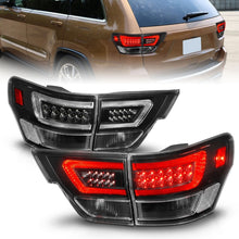 Load image into Gallery viewer, ANZO 11-13 Jeep Grand Cherokee LED Taillights w/ Lightbar Black Housing/Clear Lens 4pcs
