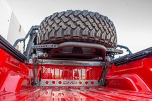 Load image into Gallery viewer, DV8 Offroad 2019+ Jeep Gladiator In-Bed Adjustable Tire Carrier
