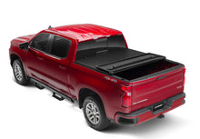 Load image into Gallery viewer, Lund 05-17 Nissan Frontier Styleside (5ft. Bed) Hard Fold Tonneau Cover - Black
